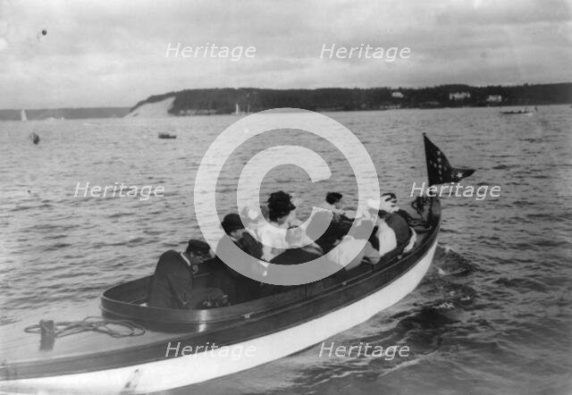 Group of well-dressed men and women in motorboat, Oyster Bay, Long Island, N.Y., 1905. Creator: Frances Benjamin Johnston.