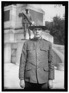 Young man in uniform standing in front of Sherman Monument, Washington, D.C., between 1916 and 1918. Creator: Harris & Ewing.