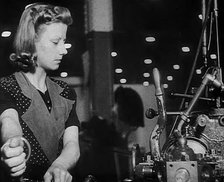 Woman Working in a Factory, 1940. Creator: British Pathe Ltd.