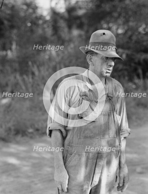 Possibly: Migratory worker in auto camp, Yakima Valley, Washington, 1939. Creator: Dorothea Lange.