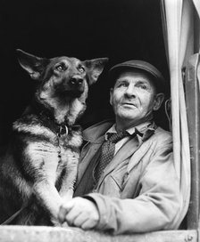 Gypsy man with dog, 1960s.