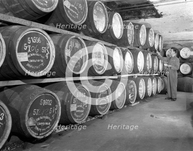 Whiskey blending at Wiley & Co, a Sheffield bonded warehouse, South Yorkshire, 1960. Artist: Michael Walters