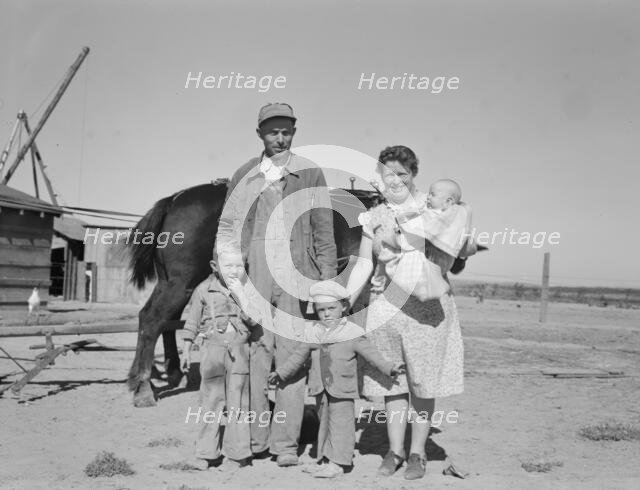 Boys wait for school bus in the morning, Malheur County, Oregon, 1939. Creator: Dorothea Lange.