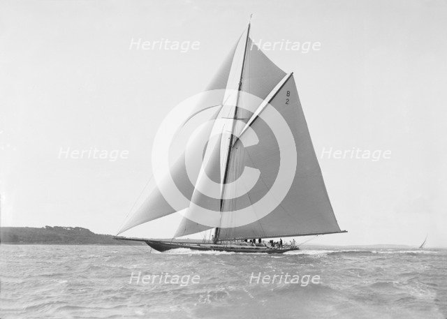 The cutter 'Shamrock' sailing close-hauled, 1912. Creator: Kirk & Sons of Cowes.