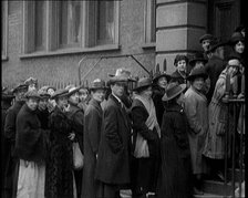 A Crowd of People Waiting an Unemployment Queue, 1924. Creator: British Pathe Ltd.