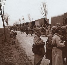 Soldiers and column of trucks on the Voie Sacrée, Verdun, northern France, c1914-c1918. Artist: Unknown.