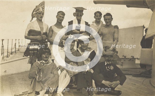 Nine men dressed up on deck, [between 1920 and 1929?]. Creator: Unknown.