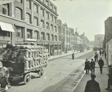 Cart laden with sacks, Mansell Street, Stepney, London, 1914. Artist: Unknown.