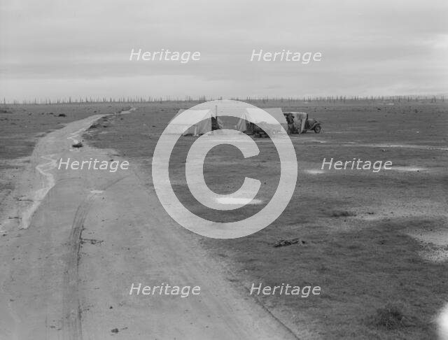 Camp of two related families seen from U.S. 99., Kern County, California, 1939. Creator: Dorothea Lange.