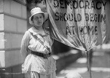 Woman Suffrage - Mrs. Swing, Picketing White House, 1917. Creator: Harris & Ewing.