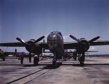 B-25 bombers on the outdoor assembly line at North American Aviation..., Kansas City, Kansas, 1942. Creator: Alfred T Palmer.