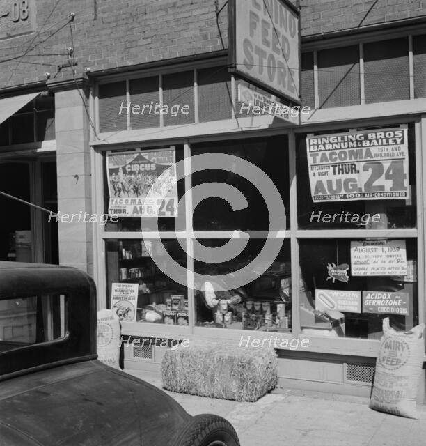 Feed store opposite bank, Tenino, Thurston County, Western Washington, 1939. Creator: Dorothea Lange.