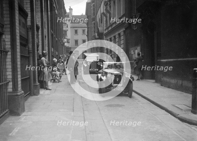 Austin 7 at a motor vehicle blessing ceremony. Artist: Bill Brunell.