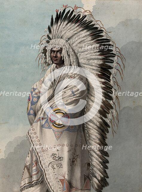 Native North American costume: a man wearing a decorated robe and a feather headdress, (1855?). Creator: Thomas Bateman.