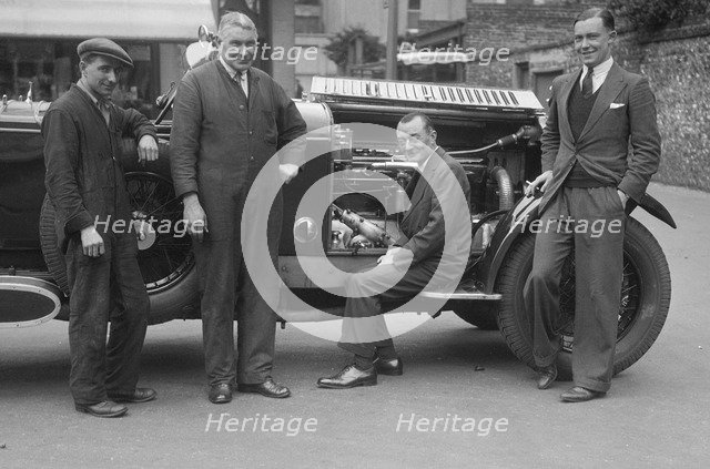 Four men posing beside a Minerva car. Artist: Bill Brunell.