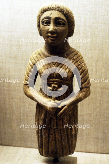 Coptic figure of woman clasping a crucifix, Sheik Ibada, Upper Egypt, 350-400. Artist: Unknown.