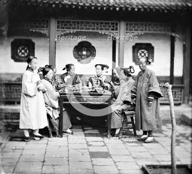 Peking, Pechili province, China: Manchu ladies at a meal table, 1869. Creator: John Thomson.