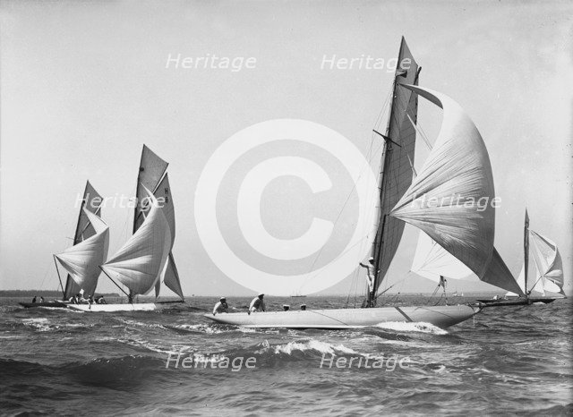 Group of 8 Metres sailing yachts racing downwind, 1911. Creator: Kirk & Sons of Cowes.