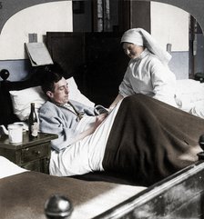 A soldier writing a letter in hospital, World War I, 1914-1918. Artist: Realistic Travels Publishers.