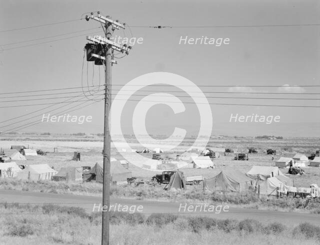 Camp of migrant potato pickers seen from potato shed..., Tulelake, Siskiyou County, California, 1939 Creator: Dorothea Lange.