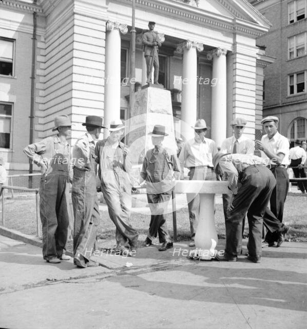 Saturday afternoon in front of the courthouse, Greenville [i.e., Greeneville], Tennessee, 1936. Creator: Dorothea Lange.