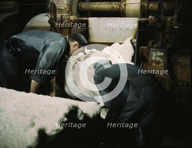 This sheet of synthetic rubber coming off the rolling mill...B.F. Goodrich Co., Akron, Ohio, 1941. Creator: Alfred T Palmer.
