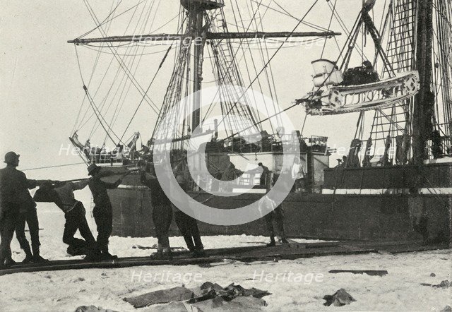 'Landing a Motor-Sledge', c1910–1913, (1913). Artist: Herbert Ponting.