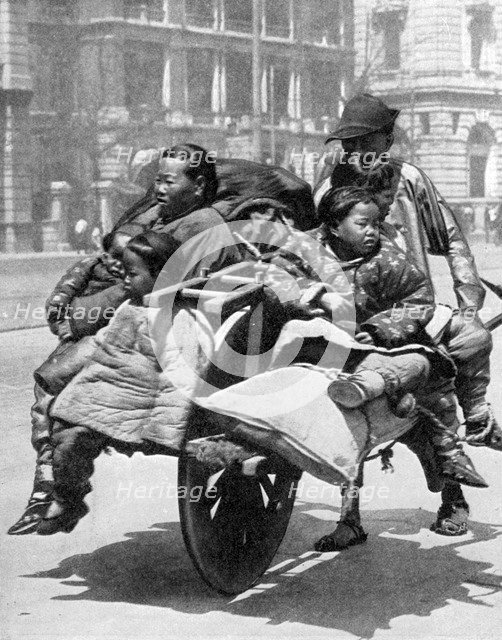 Chinese family on a cart, 1936.Artist: Sport & General