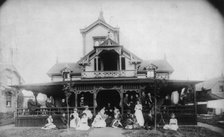 27 men and women (Johnston family) in front of beach house "Dartmouth", c1880. Creator: Unknown.