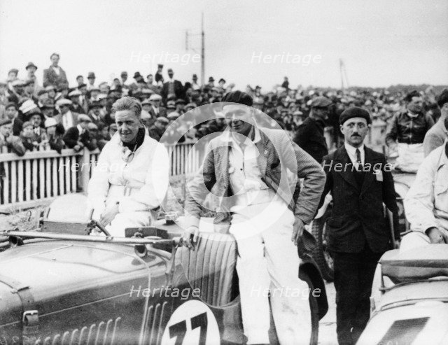 FS Barnes in the centre, AH Langley to his right, with a Singer Nine Sports car, 1930s. Artist: Unknown