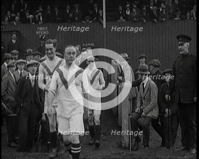 The Comedian George Robey Running Out Onto a Football Pitch in Front of a Large Crowd, 1920s. Creator: British Pathe Ltd.