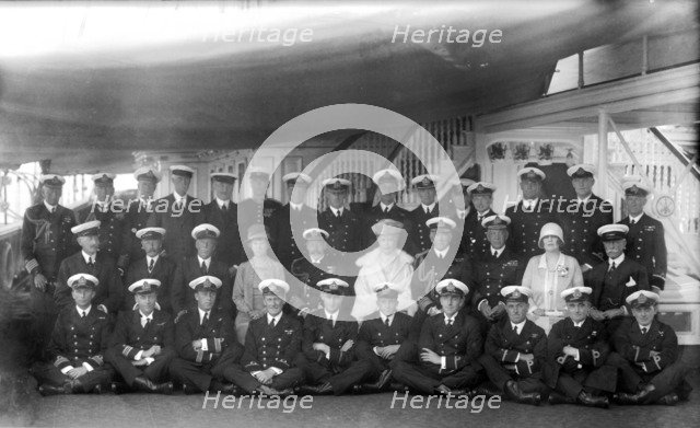 King George V and Queen Mary with the crew of 'HMY Victoria and Albert', c1935.  Creator: Kirk & Sons of Cowes.