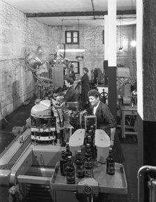 The final stages of bottling whisky at Wiley & Co, Sheffield, South Yorkshire, 1960.  Artist: Michael Walters
