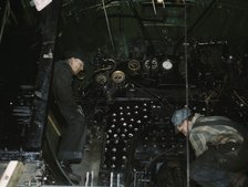 Working on the cab of a locomotive brought in for repair at the C & NW RR, Chicago, Ill., 1942. Creator: Jack Delano.