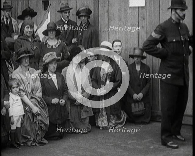 People, Mostly Women, Praying in the Street for Irish Peace Conference Success in..., 1922. Creator: British Pathe Ltd.