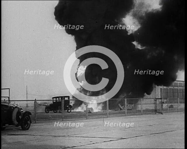 Plume of Flame Burning with Cars Nearby, 1933. Creator: British Pathe Ltd.