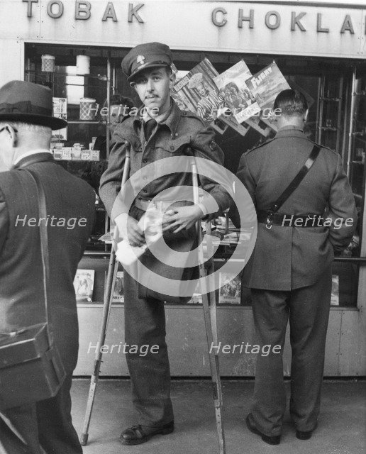 A disabled WWII Allied POW on his way home, Trelleborg railway station, Sweden, 1943. Artist: Unknown