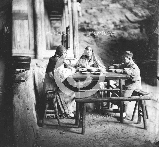 Fangguangyan monastery, Fujian province, China: three monks at the meal table, 1870-18711. Creator: John Thomson.