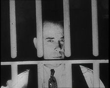 American Gangster John Dillinger Behind Bars, 1930s. Creator: British Pathe Ltd.