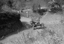 Kitty Brunell driving a 1930 2-seater Ford Model A, 1931.   Artist: Bill Brunell.