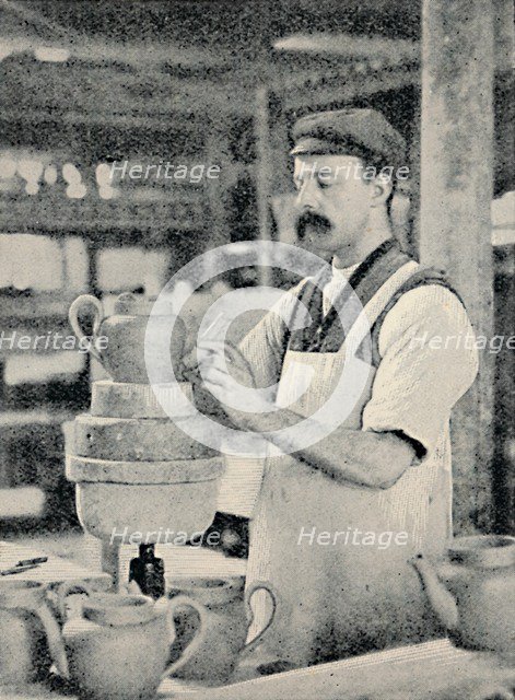 'Fixing Spout on a Teapot', c1917. Artist: Unknown.