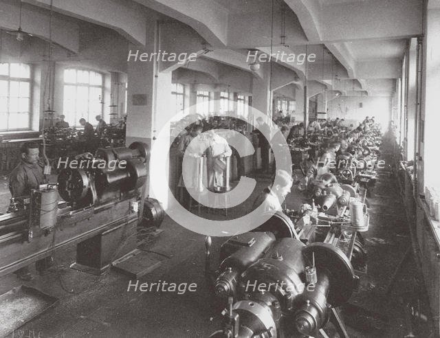 Lens Processing at the Factory of the Optical Mechanical Association in Petersburg, 1916. Artist: Anonymous  