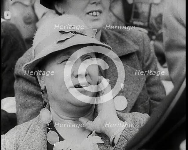 A Czech Woman in a Crowd in a Street Holding Her Left Hand up to Her Face, 1939. Creator: British Pathe Ltd.