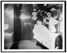 Barber shop on a deluxe overland limited train, between 1910 and 1920. Creator: Unknown.