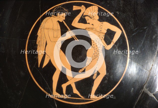 Drinking Cup, (Kylix) of Girl Dancing with Youth Playing Flute, Attic, c510 BC Artist: Epikektos.