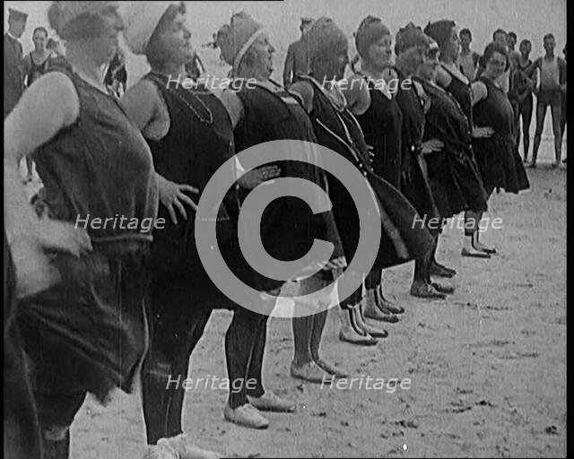 A Group of Plus Size Female Civilians Exercising on a Beach, 1920. Creator: British Pathe Ltd.