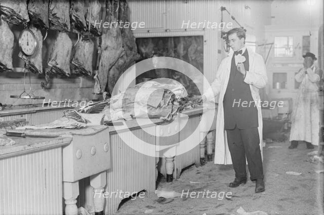 Butcher stands idle before his counter of meat during the meat boycott, 1910. Creator: Bain News Service.
