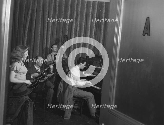 Portrait of Helen Carr, Sammy Herman, Joe Bianco, and Donn Trenner, Nola's, N.Y., ca. Feb. 1947. Creator: William Paul Gottlieb.
