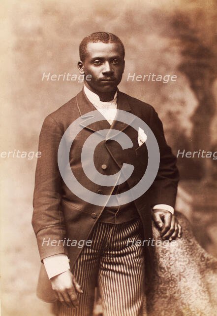 Studio portrait of a man dressed in jacket, vest, tie and striped pants, c1880-c1889. Creator: Alexander Hesler.