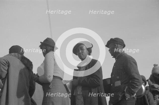 Possibly: Negroes in the lineup for food at meal time in the camp..., Forrest City, Arkansas, 1937. Creator: Walker Evans.